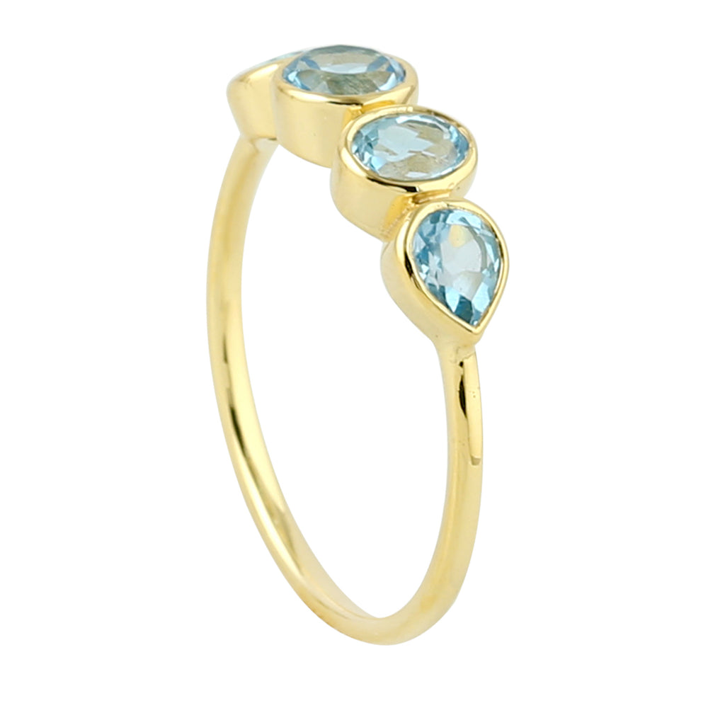 Bezel Set Blue Topaz Four Stone Design Band Ring In 14K Yellow Gold